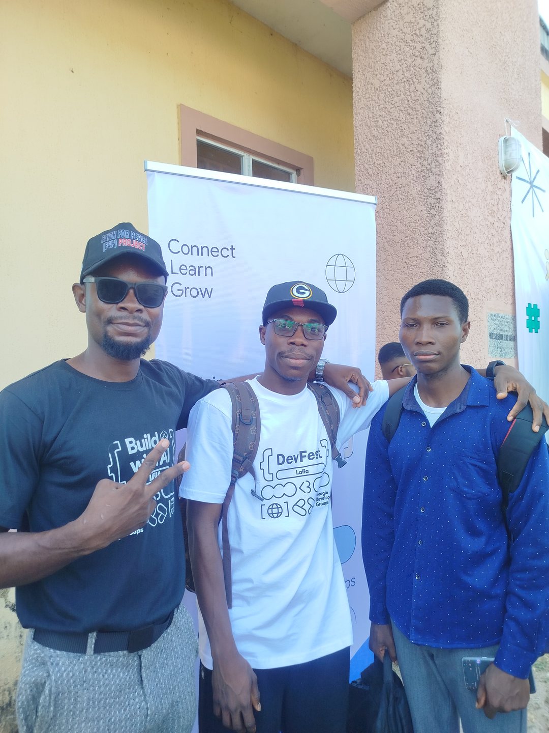DevFest Lafia Attendees at the venue banner